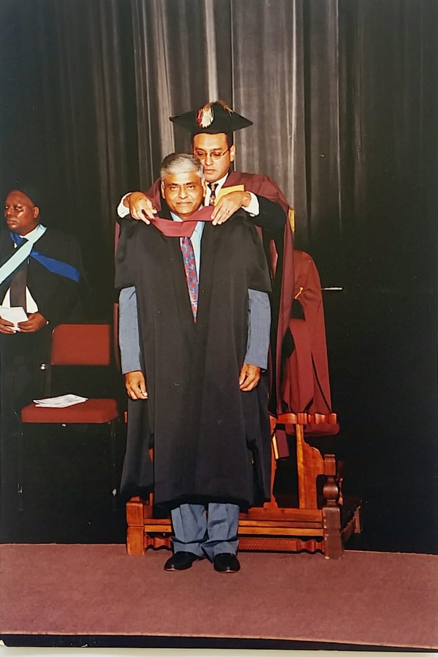 A person in a graduation gown
AI-generated content may be incorrect.