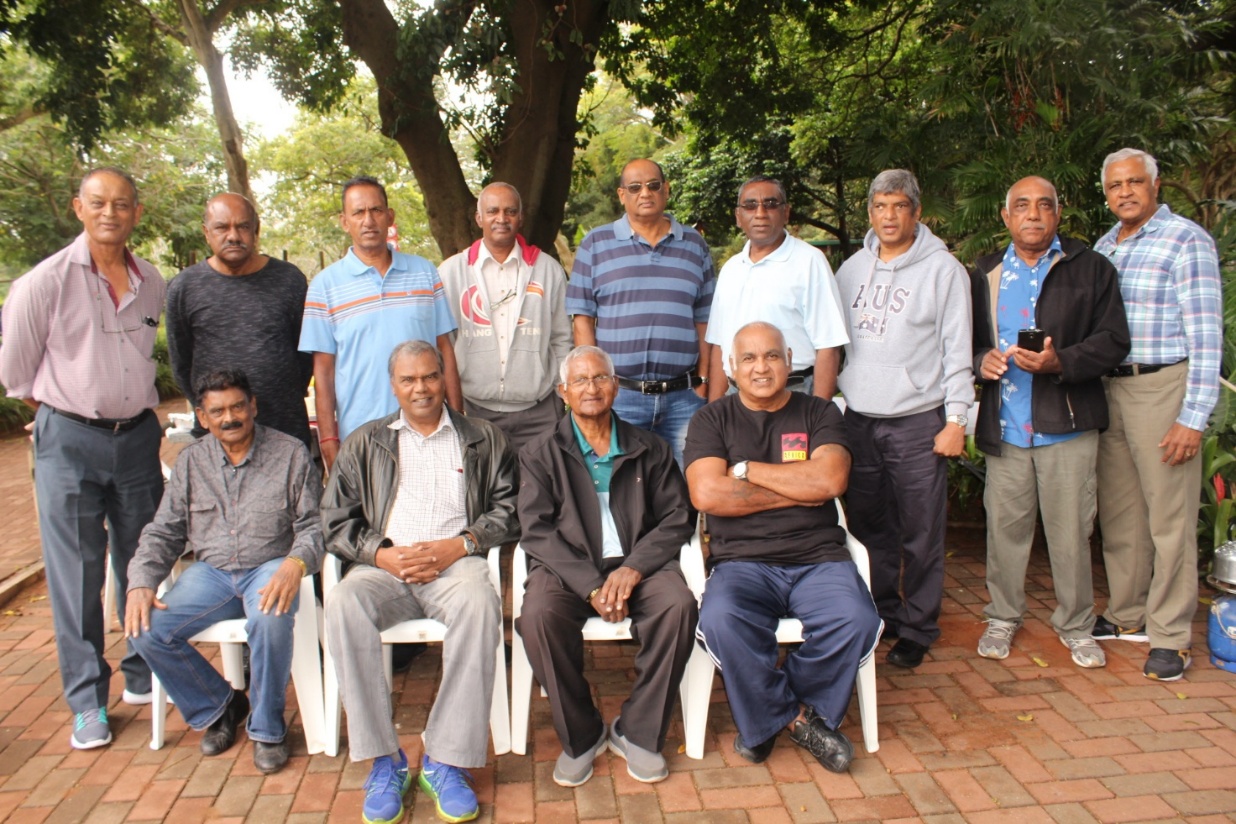 A group of men posing for a photo AI-generated content may be incorrect.
