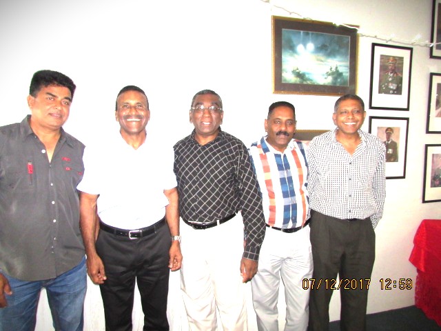 A group of men standing together AI-generated content may be incorrect.