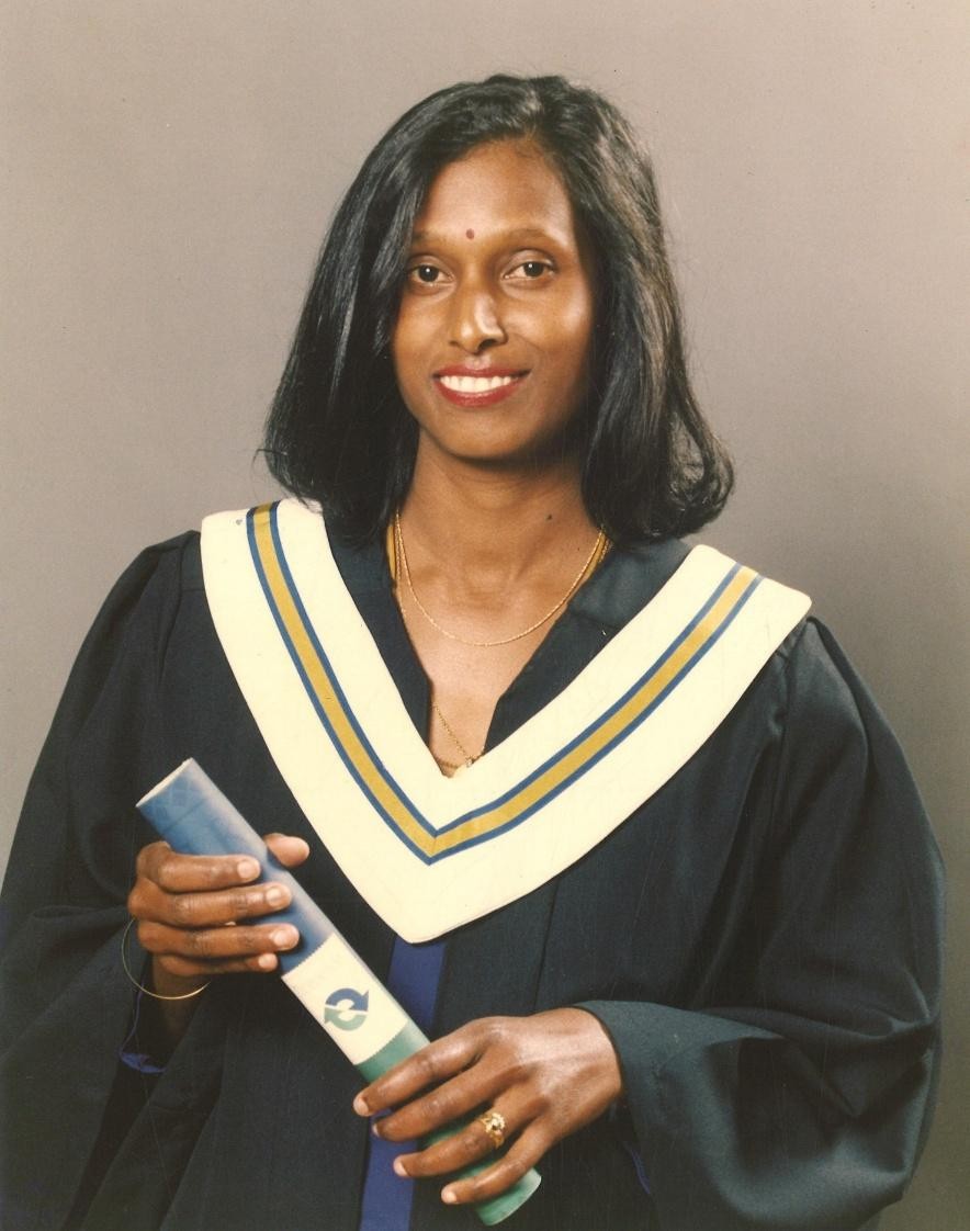 A person in a graduation gown AI-generated content may be incorrect.