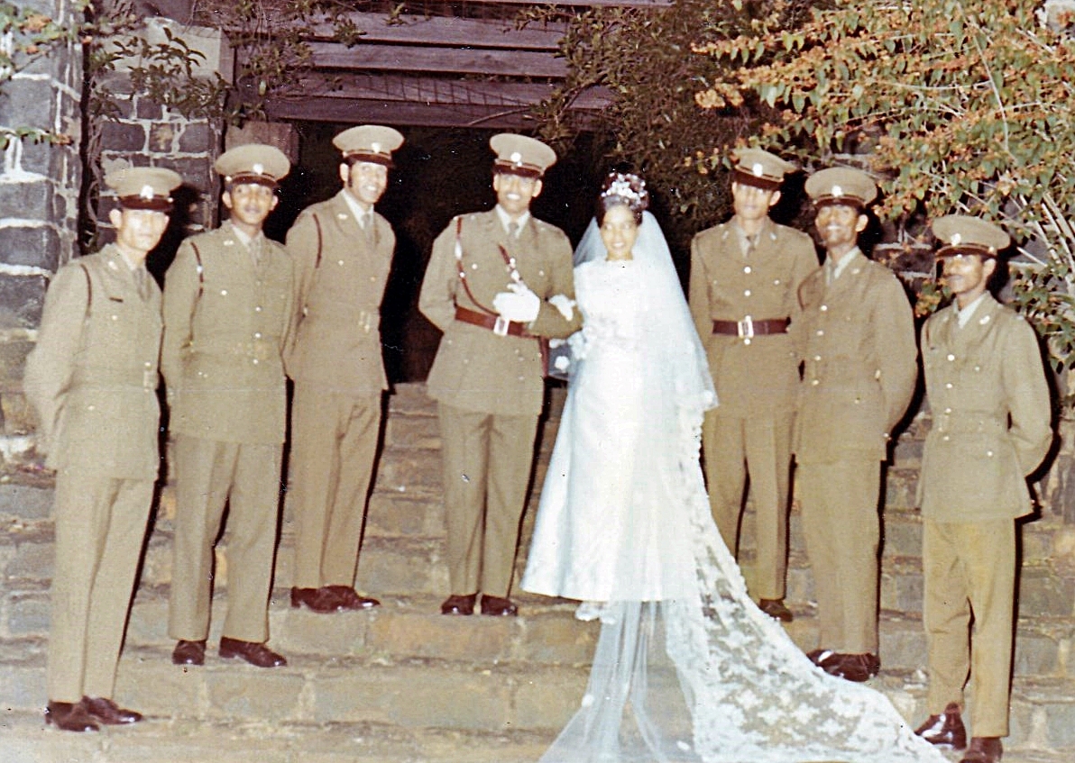A bride and groom posing for a photo AI-generated content may be incorrect.