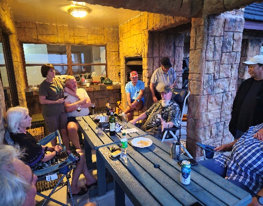 A group of people around a table AI-generated content may be incorrect.
