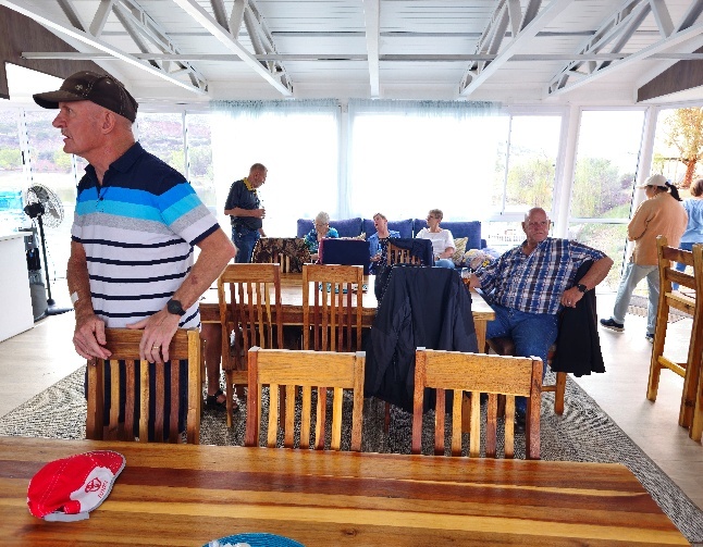 A group of people sitting around a table AI-generated content may be incorrect.