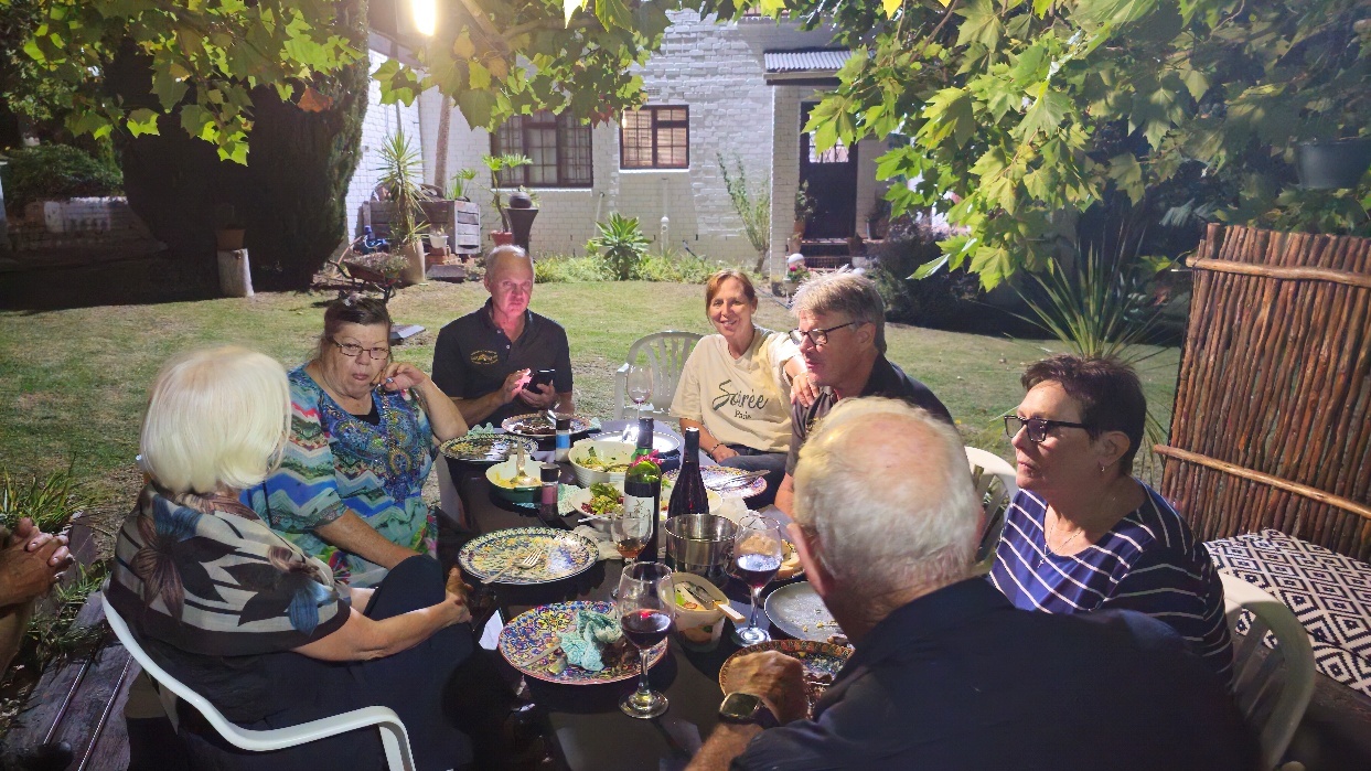 A group of people sitting around a table AI-generated content may be incorrect.