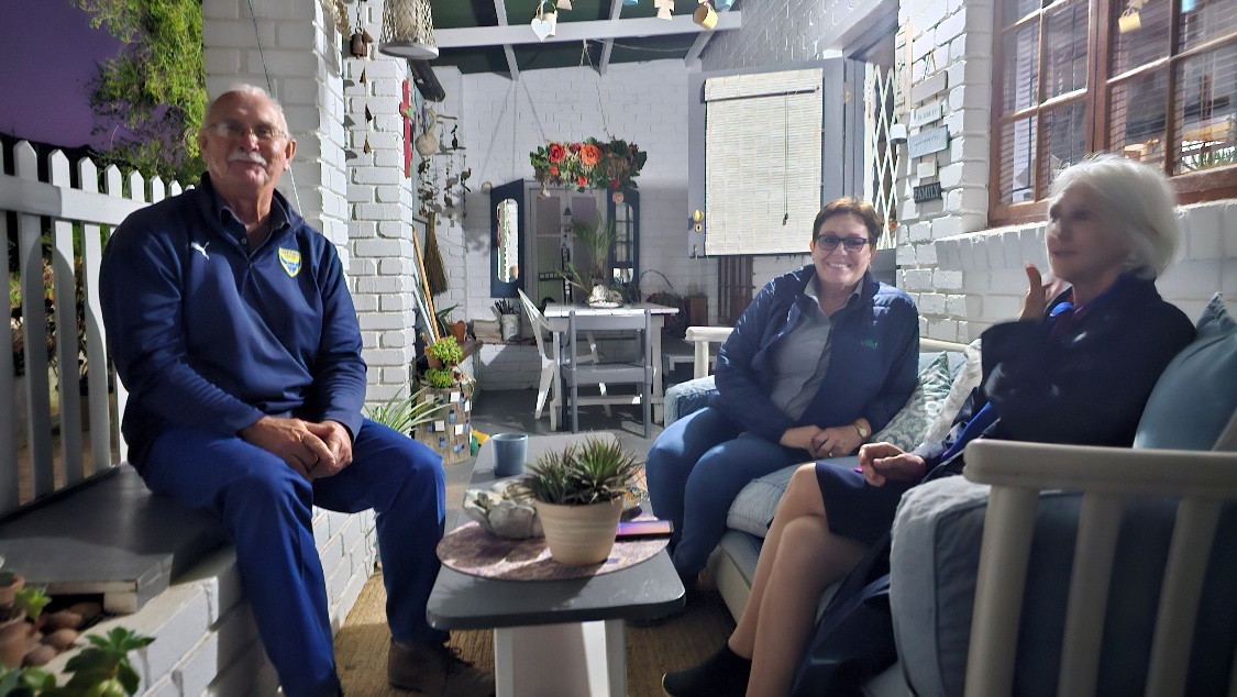 A group of people sitting on couches AI-generated content may be incorrect.