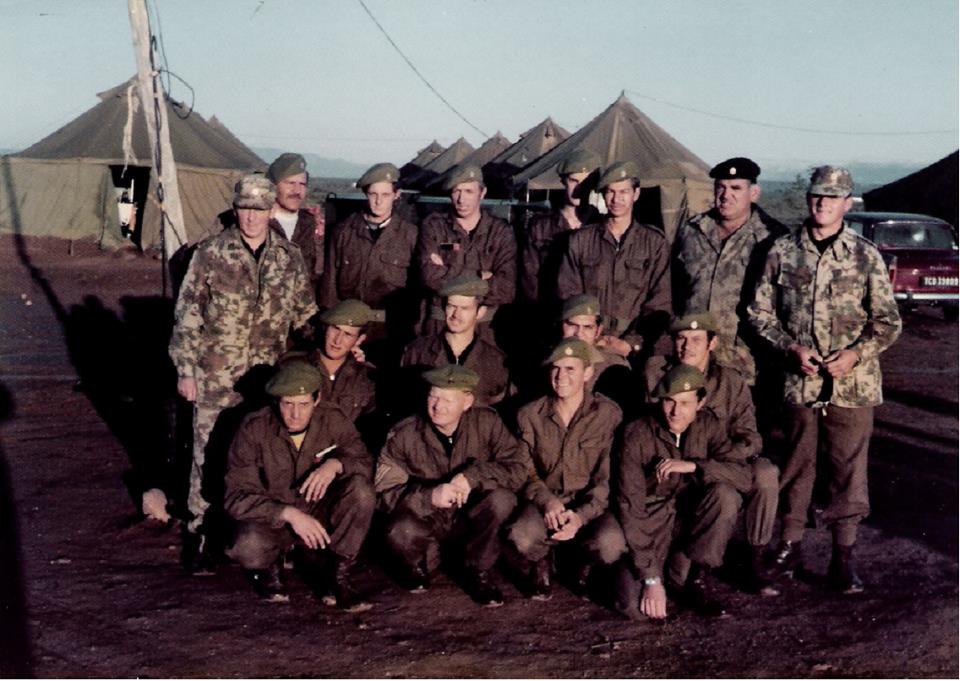 A group of soldiers posing for a photo AI-generated content may be incorrect.