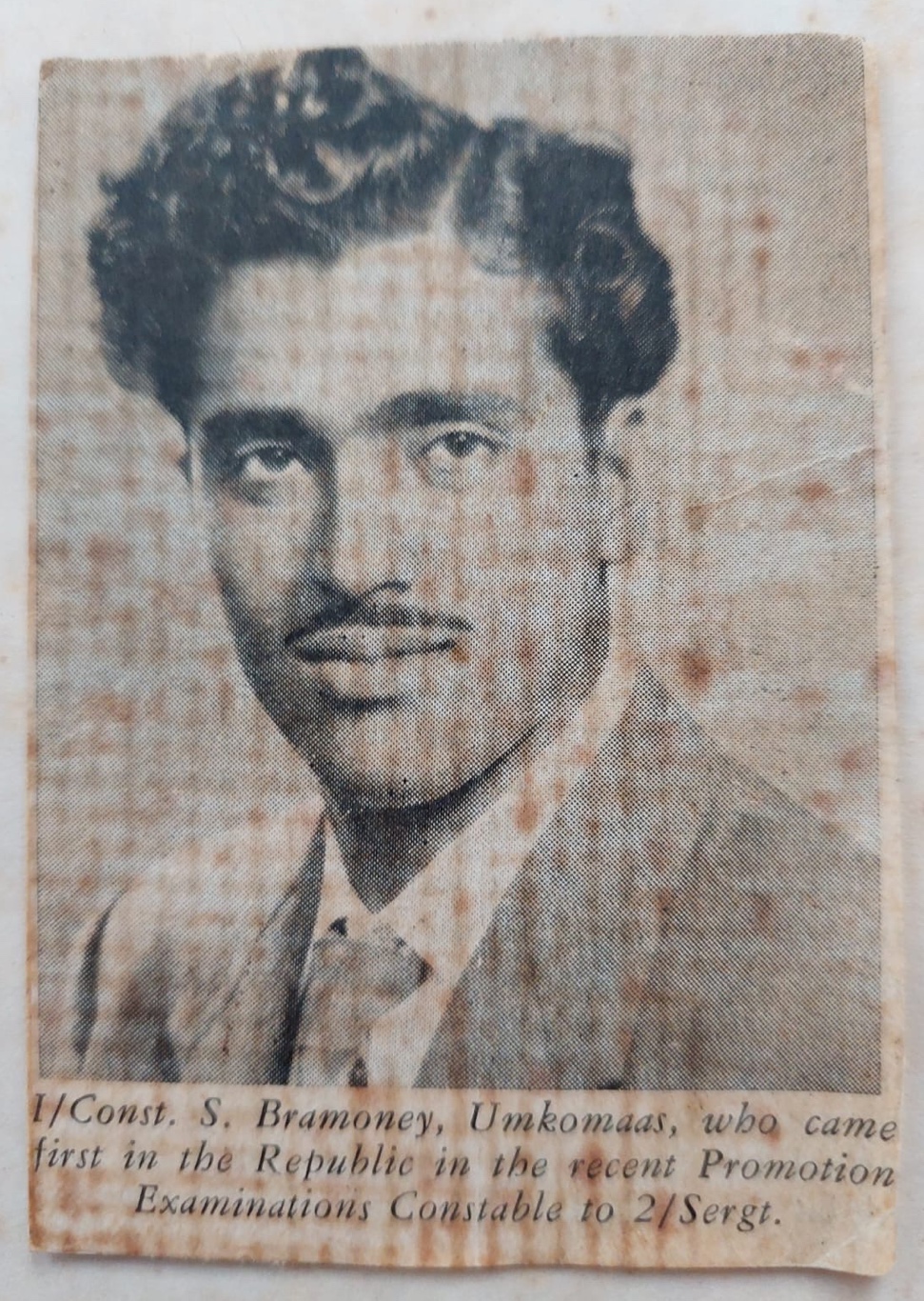 A person with a mustache and a suit AI-generated content may be incorrect.