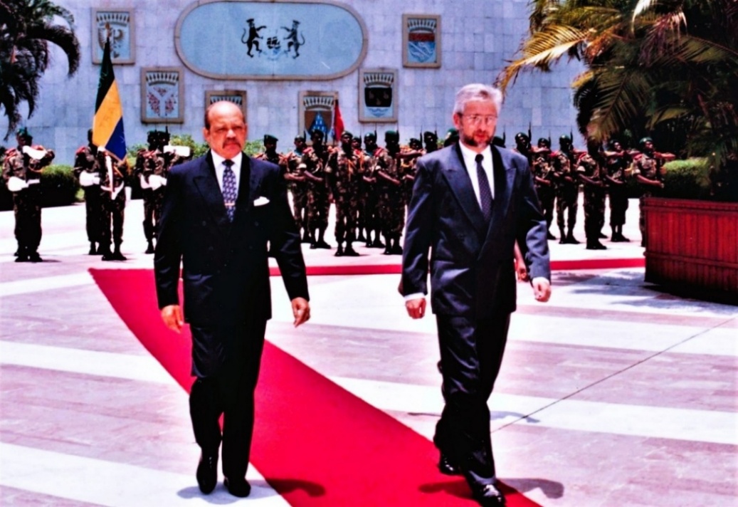 Men in suits walking on a red carpet AI-generated content may be incorrect.