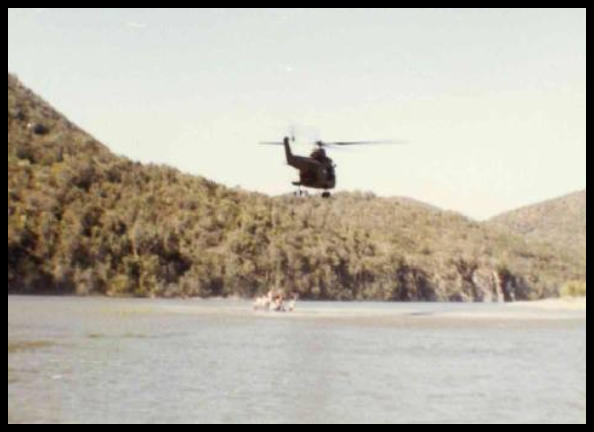 A helicopter flying over water AI-generated content may be incorrect.