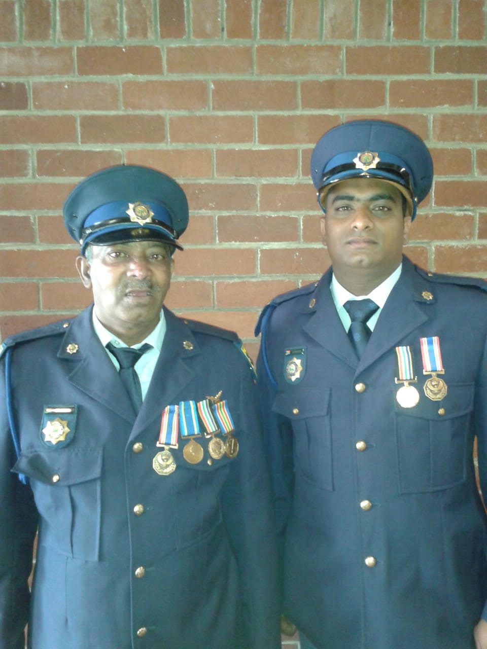 A couple of men in military uniforms AI-generated content may be incorrect.