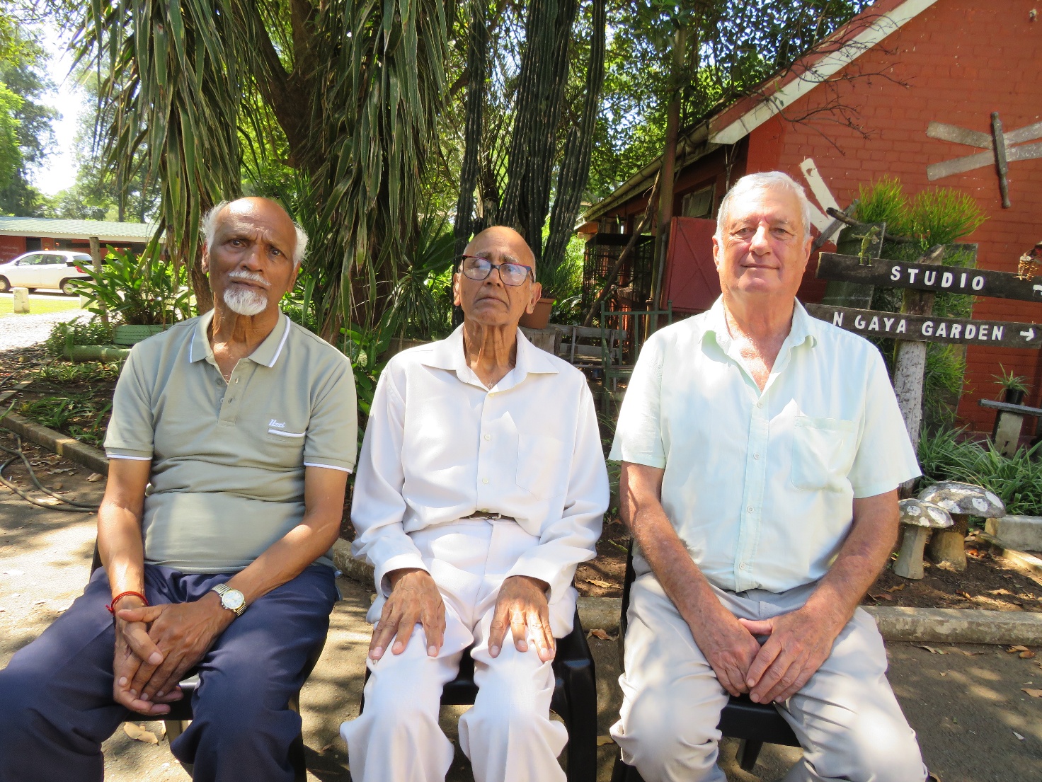 A group of men sitting outside
AI-generated content may be incorrect.