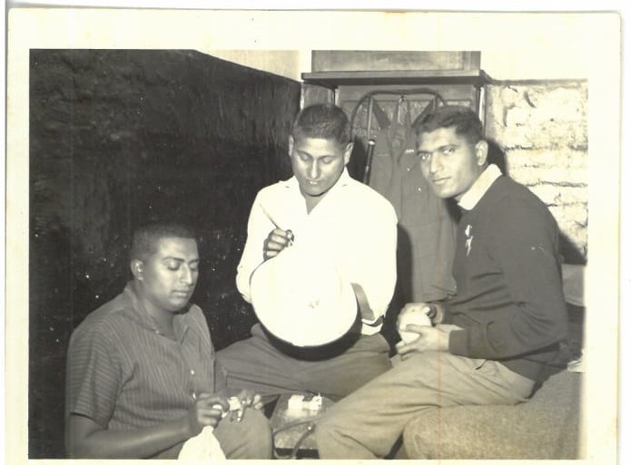 A group of men sitting together
AI-generated content may be incorrect.