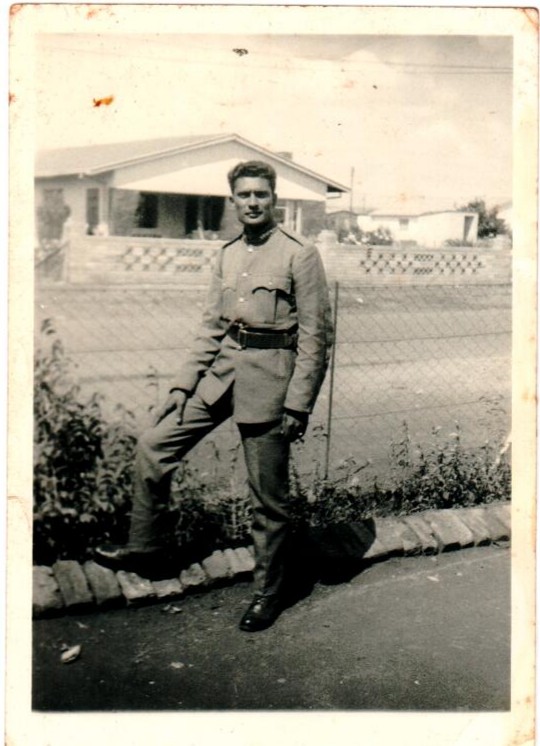A person in a uniform leaning on a curb
AI-generated content may be incorrect.