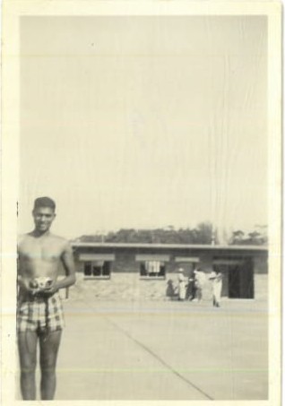 A person standing in front of a building
AI-generated content may be incorrect.