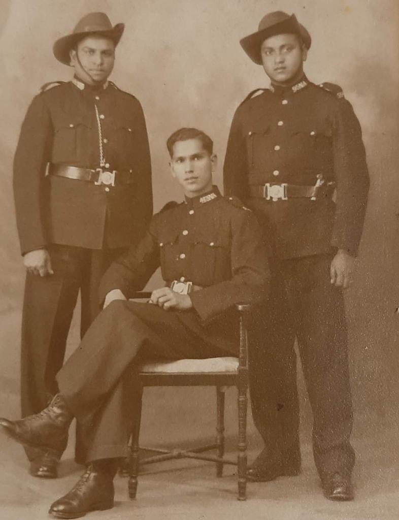 A group of men in military uniforms AI-generated content may be incorrect.