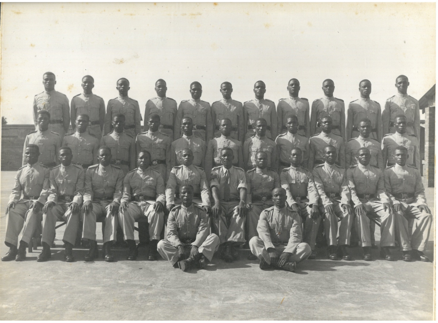 A group of people in uniform posing for a photo AI-generated content may be incorrect.