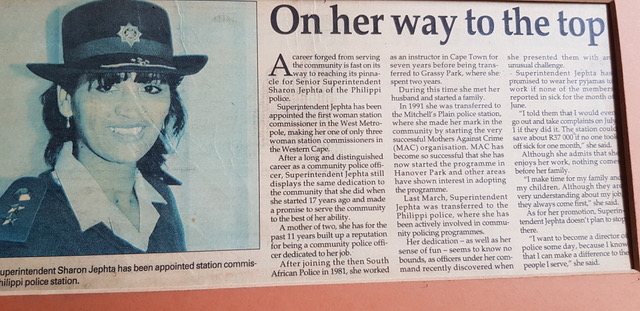 A newspaper with a picture of a person in a hat AI-generated content may be incorrect.