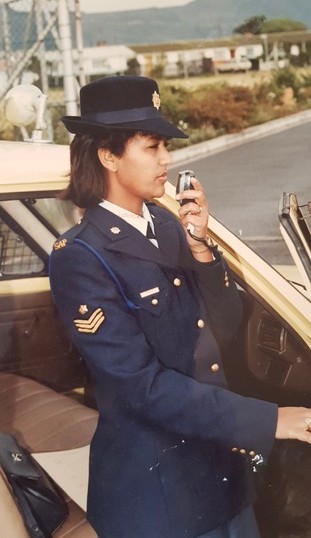 A person in a uniform holding a cell phone AI-generated content may be incorrect.